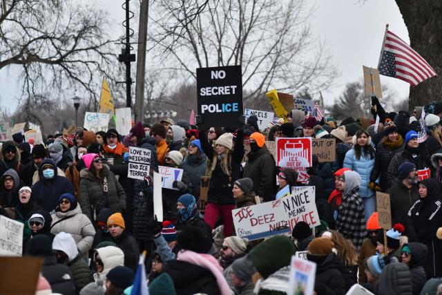 Protesters hold signs as they march from Powderhorn Park in Minneapolis against Immigration and Customs Enforcement (ICE) and the fatal shooting of Renee Good by an ICE agent, calling on federal authorities to leave the city and demand accountability, in Minneapolis, Minnesota, on January 10, 2026. A US Immigration and Customs Enforcement (ICE) agent shot and killed 37-year-old Renee Nicole Good on the streets of Minneapolis on January 7, leading to huge protests and outrage from local leaders who rejected White House claims she was a domestic terrorist. (Photo by Octavio JONES / AFP)