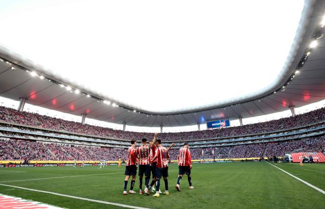 Guadalajara players celebrate after scoring their second goal during the Liga MX Clausura football match between Guadalajara and Pachuca at the Akron Stadium in Zapopan, Mexico on January 10, 2026. (Photo by Ulises Ruiz / AFP)