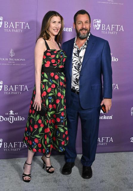 Jackie Sandler (L) and US actor Adam Sandler attend the BAFTA Tea Party at The Four Seasons Hotel in Beverly Hills, California on January 10, 2026. (Photo by LISA O'CONNOR / AFP)