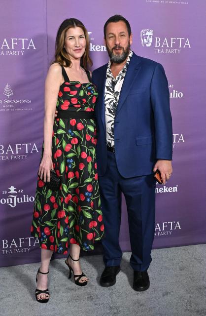 Jackie Sandler (L) and US actor Adam Sandler attend the BAFTA Tea Party at The Four Seasons Hotel in Beverly Hills, California on January 10, 2026. (Photo by LISA O'CONNOR / AFP)