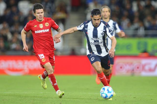 Toluca's forward #15 Pavel Perez and Monterrey's midfielder #14 Erick Aguirre fight for the ball during the Liga MX Clausura football match between Monterrey and Toluca at BBVA Stadium in Monterrey, Nuevo Leon state, Mexico on January 10, 2026. (Photo by Julio Cesar AGUILAR / AFP)