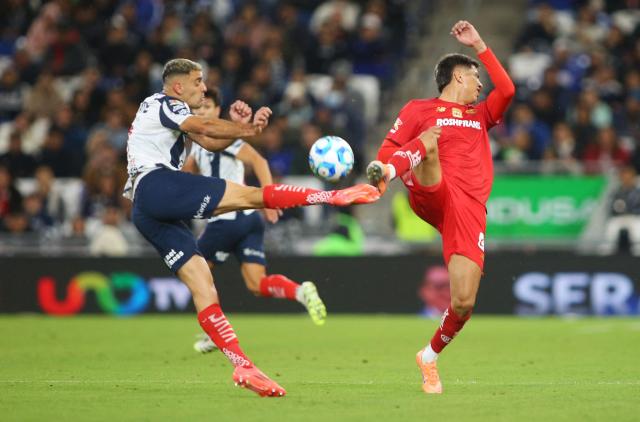 Monterrey's Argentine forward #07 German Berterame and Toluca's Argentine midfielder #08 Nicolas Castro fight for the ball during the Liga MX Clausura football match between Monterrey and Toluca at BBVA Stadium in Monterrey, Nuevo Leon state, Mexico on January 10, 2026. (Photo by Julio Cesar AGUILAR / AFP)