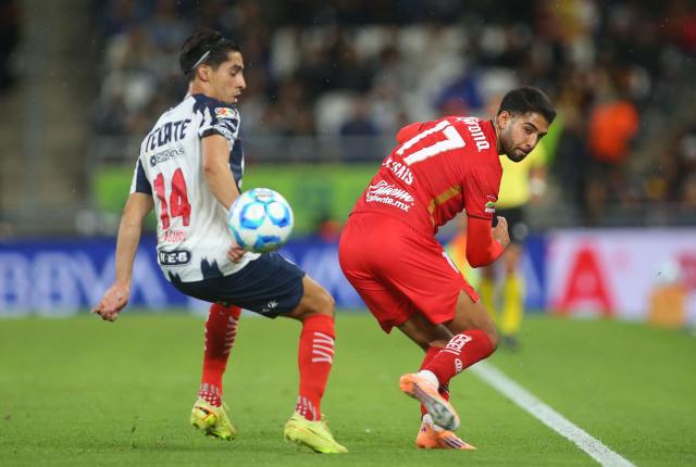 Monterrey's midfielder #14 Erick Aguirre and Toluca's defender #17 Mauricio Isais fight for the ball during the Liga MX Clausura football match between Monterrey and Toluca at BBVA Stadium in Monterrey, Nuevo Leon state, Mexico on January 10, 2026. (Photo by Julio Cesar AGUILAR / AFP)