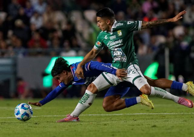 Cruz Azul's forward #18 Luka Romero and Leon's forward #07 Ivan Moreno fight for the ball during the Liga MX Clausura football match between Leon and Cruz Azul at Leon Stadium in Leon, Mexico on January 10, 2026. (Photo by Mario VAZQUEZ / AFP)