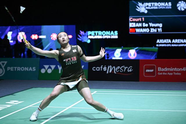 South Korea’s An Se-young plays a point during her women's singles final match against China's Wang Zhiyi at the Malaysia Open badminton tournament in Kuala Lumpur on January 11, 2026. (Photo by MOHD RASFAN / AFP)
