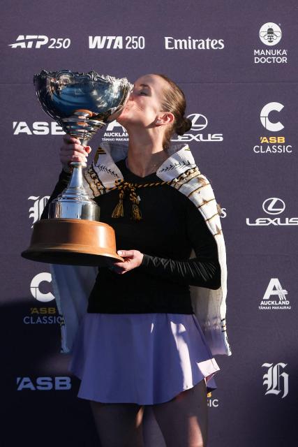 Ukraine's Elina Svitolina celebrates with the trophy after her win against China's Wang Xinyu during the women's singles final at the WTA Auckland Classic tennis tournament in Auckland on January 11, 2026. (Photo by Michael Bradley / AFP)