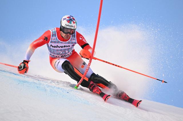 Switzerland’s Daniel Yule competes in the first run of the Men's Slalom, part of the FIS Alpine Ski World Cup 2025-2026 in Adelboden, soutwestern Switzerland on January 11, 2026. (Photo by Fabrice COFFRINI / AFP)