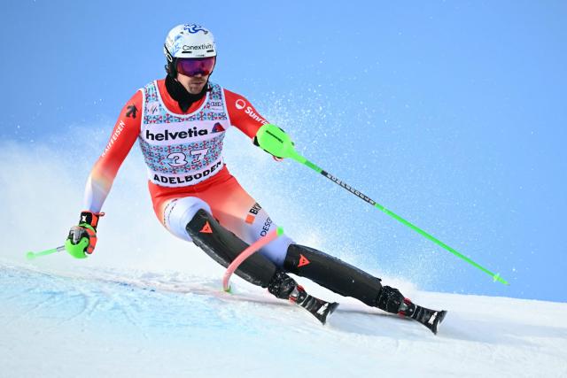 Switzerland’s Marc Rochat competes in the first run of the Men's Slalom, part of the FIS Alpine Ski World Cup 2025-2026 in Adelboden, soutwestern Switzerland on January 11, 2026. (Photo by Fabrice COFFRINI / AFP)