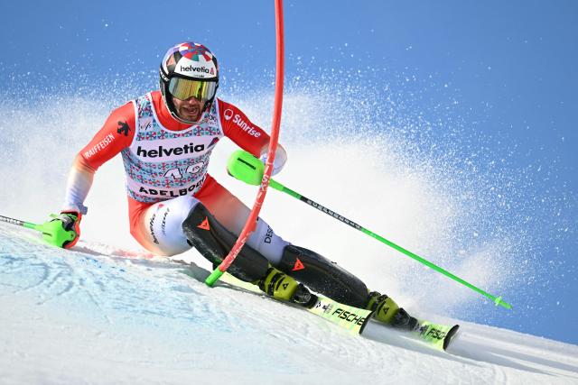 Switzerland’s Luca Aerni competes in the first run of the Men's Slalom, part of the FIS Alpine Ski World Cup 2025-2026 in Adelboden, soutwestern Switzerland on January 11, 2026. (Photo by Fabrice COFFRINI / AFP)