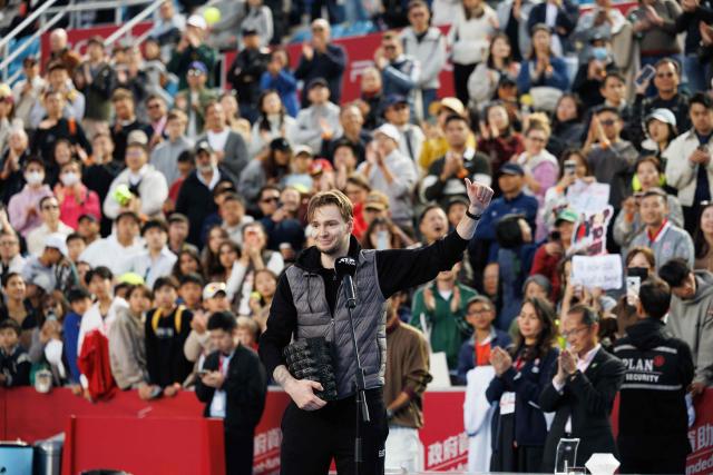 Kazakhstan's Alexander Bublik celebrates with the trophy after his victory against Italy's Lorenzo Musetti during the men's singles final at the Hong Kong Tennis Open in Hong Kong on January 11, 2026. (Photo by May JAMES / AFP)