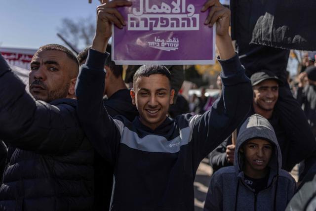 Arab-Israelis protest against crime and police raids, chanting slogans against Israel's far-right National Security Minister, outside the Israeli Governmental offices, in Jerusalem on January 11, 2026. (Photo by ILIA YEFIMOVICH / AFP)