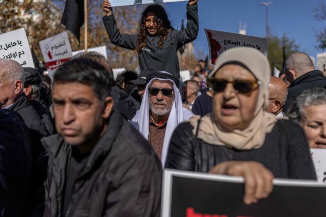 Arab-Israelis protest against crime and police raids, chanting slogans against Israel's far-right National Security Minister, outside the Israeli Governmental offices, in Jerusalem on January 11, 2026. (Photo by ILIA YEFIMOVICH / AFP)
