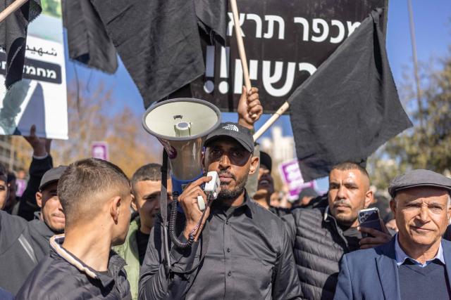 Arab-Israelis protest against crime and police raids, chanting slogans against Israel's far-right National Security Minister, outside the Israeli Governmental offices, in Jerusalem on January 11, 2026. (Photo by ILIA YEFIMOVICH / AFP)
