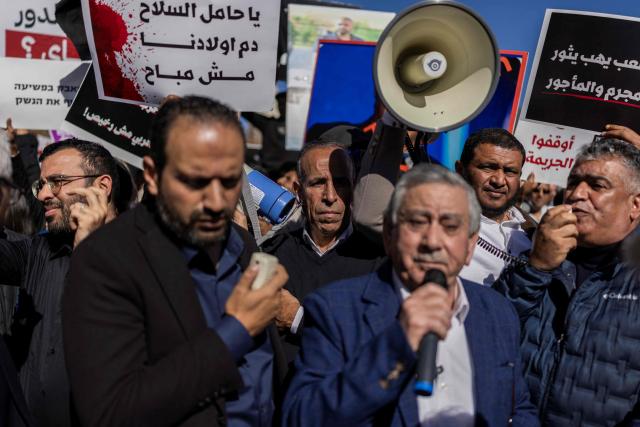 Arab-Israelis protest against crime and police raids, chanting slogans against Israel's far-right National Security Minister, outside the Israeli Governmental offices, in Jerusalem on January 11, 2026. (Photo by ILIA YEFIMOVICH / AFP)