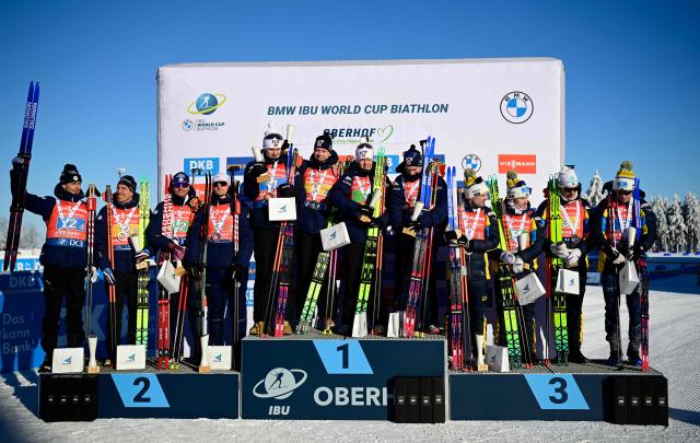 (L-R) The second placed team of France with France's Eric Perrot, France's Quentin Fillon Maillet, France's Emilien Jacquelin and France's Fabien Claude; the winning team of Norway with Norway's Vetle Sjastad Christiansen, Norway's Martin Uldal, Norway's Johannes Dale-Skjevdal and Norway's Isak Frey and the third placed team of Sweden with Sweden's Sebastian Samuelsson, Sweden's Martin Ponsiluoma, Sweden's Malte Stefansson and Sweden's Jesper Nelin pose on the podium after the men's 4x7,5km relay event of the IBU Biathlon World Cup in Oberhof, eastern Germany on January 11, 2026. (Photo by Tobias SCHWARZ / AFP)