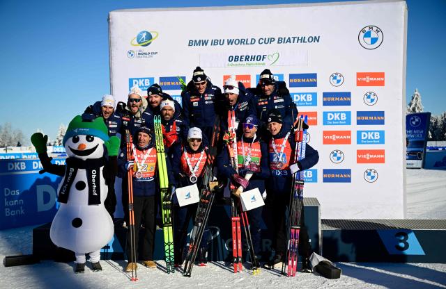 The second placed team of France with France's Eric Perrot, France's Quentin Fillon Maillet, France's Emilien Jacquelin and France's Fabien Claude pose on the podium after the men's 4x7,5km relay event of the IBU Biathlon World Cup in Oberhof, eastern Germany on January 11, 2026. (Photo by Tobias SCHWARZ / AFP)