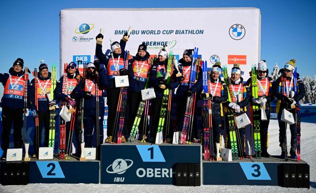 (L-R) The second placed team of France with France's Eric Perrot, France's Quentin Fillon Maillet, France's Emilien Jacquelin and France's Fabien Claude; the winning team of Norway with Norway's Vetle Sjastad Christiansen, Norway's Martin Uldal, Norway's Johannes Dale-Skjevdal and Norway's Isak Frey and the third placed team of Sweden with Sweden's Sebastian Samuelsson, Sweden's Malte Stefansson, Sweden's Martin Ponsiluoma and Sweden's Jesper Nelin pose on the podium after the men's 4x7,5km relay event of the IBU Biathlon World Cup in Oberhof, eastern Germany on January 11, 2026. (Photo by Tobias SCHWARZ / AFP)