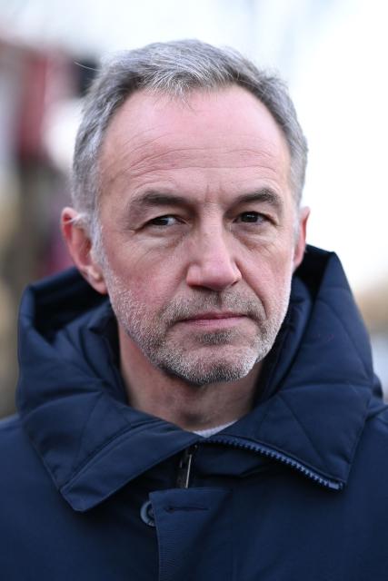 Socialist Party's (PS) MP and candidate for the mayor of Paris, Emmanuel Gregoire looks on during a campaign visit in the 13th arrondissement of Paris on January 11, 2026. (Photo by Bertrand GUAY / AFP)