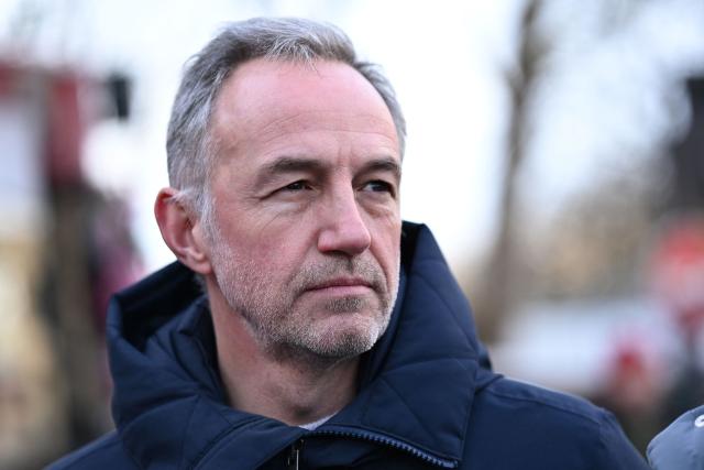 Socialist Party's (PS) MP and candidate for the mayor of Paris, Emmanuel Gregoire looks on during a campaign visit in the 13th arrondissement of Paris on January 11, 2026. (Photo by Bertrand GUAY / AFP)