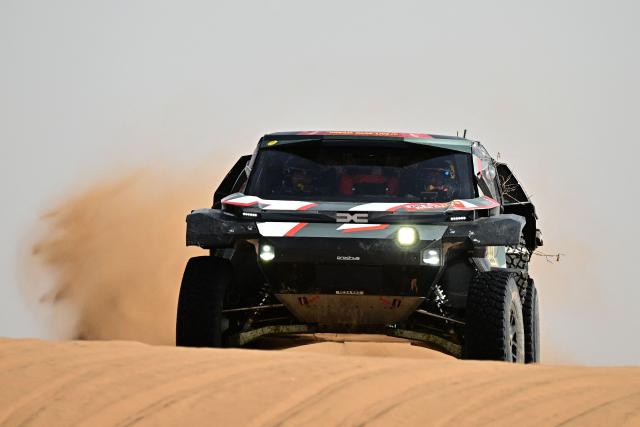 The Dacia Sandriders’s Qatari driver Nasser Al?Attiyah and Belgian co?pilot Fabian Lurquin compete in the Stage 7 of the 48th edition of the Dakar Rally 2026, between Riyadh and Wadi ad-Dawasir, Saudi Arabia, on January 11, 2026. (Photo by Giuseppe CACACE / AFP)