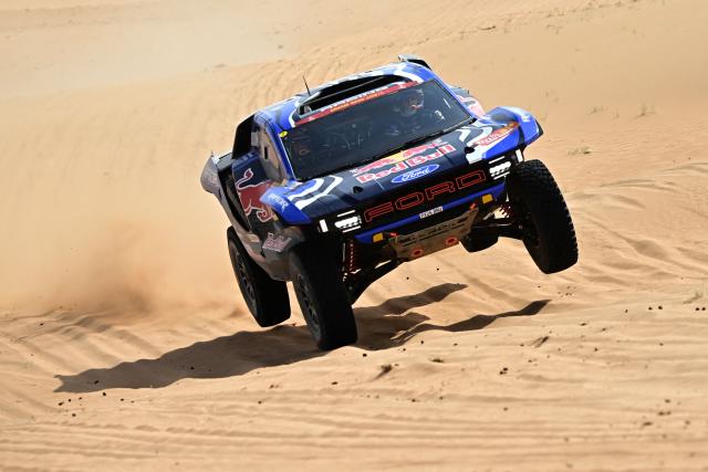 Ford Racing’s Spanish driver Nani Roma and Spanish co?pilot Alex Haro compete in the Stage 7 of the 48th edition of the Dakar Rally 2026, between Riyadh and Wadi ad-Dawasir, Saudi Arabia, on January 11, 2026. (Photo by Giuseppe CACACE / AFP)