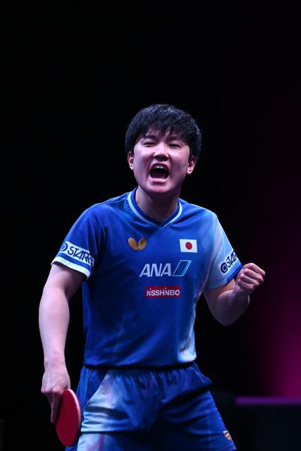 Japan's Tomokazu Harimoto reacts after a point against Taiwan's Lin Yun-ju during their men's singles semi-final match during the World Table Tennis (WTT) Champions tournament at the Infinity Arena in Doha on January 11, 2026. (Photo by Mahmud HAMS / AFP)