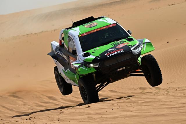 Energylandia Rally Team’s Polish driver Eryk Goczal and Polish co?pilot Szymon Gospodarczyk compete in the Stage 7 of the 48th edition of the Dakar Rally 2026, between Riyadh and Wadi ad-Dawasir, Saudi Arabia, on January 11, 2026. (Photo by Giuseppe CACACE / AFP)