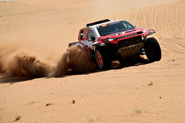 Toyota Gazoo Racing W2rc’s South African driver Henk Lategan and South African co?pilot Brett Cummings compete in the Stage 7 of the 48th edition of the Dakar Rally 2026, between Riyadh and Wadi ad-Dawasir, Saudi Arabia, on January 11, 2026. (Photo by Giuseppe CACACE / AFP)