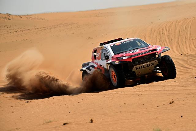 Toyota Gazoo Racing W2rc’s South African driver Henk Lategan and South African co?pilot Brett Cummings compete in the Stage 7 of the 48th edition of the Dakar Rally 2026, between Riyadh and Wadi ad-Dawasir, Saudi Arabia, on January 11, 2026. (Photo by Giuseppe CACACE / AFP)