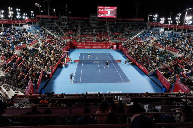 Russia's Andrey Rublev (L) and Karen Khachanov hit a return against Italy's Lorenzo Sonego (R) and Lorenzo Musetti during their men's doubles final match at the Hong Kong Tennis Open in Hong Kong on January 11, 2026. (Photo by May JAMES / AFP)