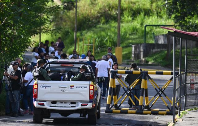 Relatives of prisoners queue outside El Rodeo I prison in Guatire, Miranda State, some 30 kilometers east of Caracas on January 11, 2026. Venezuelans were waiting for more political prisoners to be released, as ousted president Nicolas Maduro defiantly claimed from his US jail cell that he is "doing fine" after being seized by US forces a week ago. (Photo by Ronaldo SCHEMIDT / AFP)