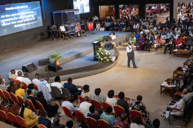 A pastor preaches to his congregation to observe peace during a service at Victory church in Kampala, on January 11, 2026, ahead of the 2026 Ugandan general election. (Photo by Badru Katumba / AFP)