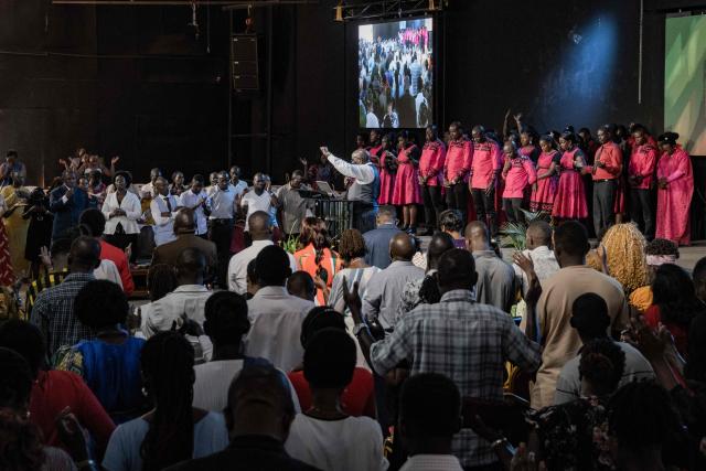 A pastor preaches to his congregation to observe peace during a service at Victory church in Kampala, on January 11, 2026, ahead of the 2026 Ugandan general election. (Photo by Badru Katumba / AFP)