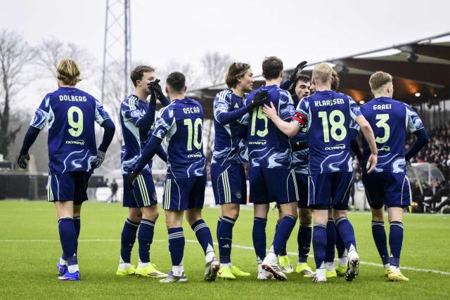 Ajax players celebrate after scoring their team first goal during the Dutch Eredivisie football match between Telstar and Ajax at BUKO Stadion in Velsen-Zuid on January 11, 2026. (Photo by Olaf KRAAK / ANP / AFP) / Netherlands OUT