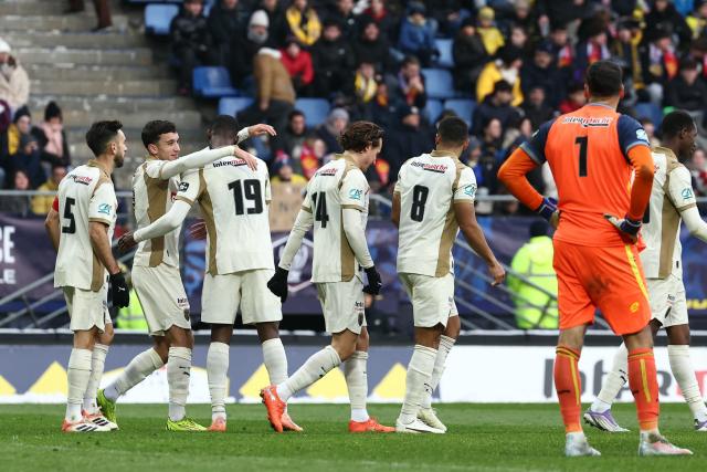 Lens’ players celebrate after scoring during the French Cup round of 32 football match between FC Sochaux-Montbeliard and RC Lens at the Auguste-Bonal stadium in Sochaux, eastern France on January 11, 2026. (Photo by Frederick FLORIN / AFP)