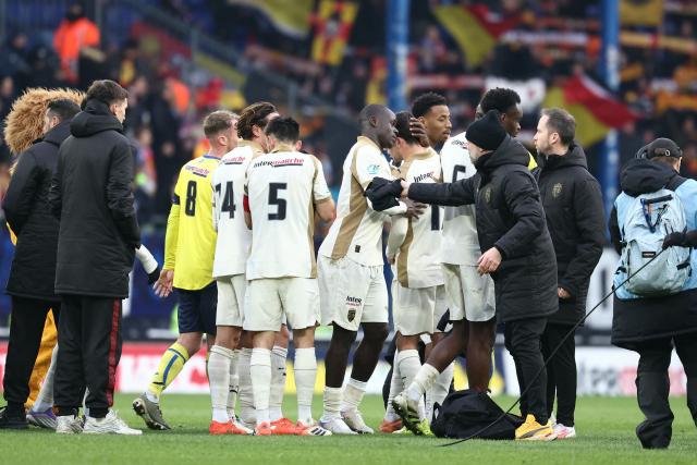 Lens’ players celebrate after winning the French Cup round of 32 football match between FC Sochaux-Montbeliard and RC Lens at the Auguste-Bonal stadium in Sochaux, eastern France on January 11, 2026. (Photo by Frederick FLORIN / AFP)