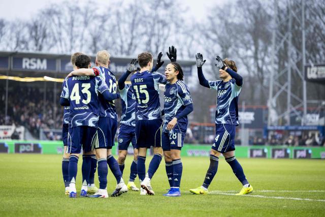 Ajax's Dutch defender #15 Youri Baas (C) celebrates his goal with teammates during the Dutch Eredivisie football match between Telstar and Ajax at BUKO Stadion in Velsen-Zuid on January 11, 2026. (Photo by Sonny Lensen / ANP / AFP) / Netherlands OUT