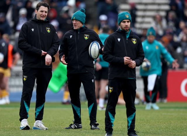 Northampton Saints' Head Coach Sam Vesty (C) speaks with an assitant before the start of the European Champions Cup first round, day 3, pool 4, rugby union match between Bordeaux-Begles and Northampton Saints at the Chaban-Delmas stadium in Bordeaux on January 11, 2026. (Photo by ROMAIN PERROCHEAU / AFP)