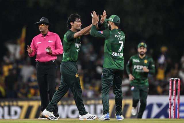 Pakistan's Naseem Shah (2L) celebrates with teammates after taking the wicket of Sri Lanka's Pathum Nissanka during the third and final Twenty20 international cricket match between Pakistan and Sri Lanka at the Rangiri Dambulla International Stadium in Dambulla on January 11, 2026. (Photo by Ishara S. KODIKARA / AFP)