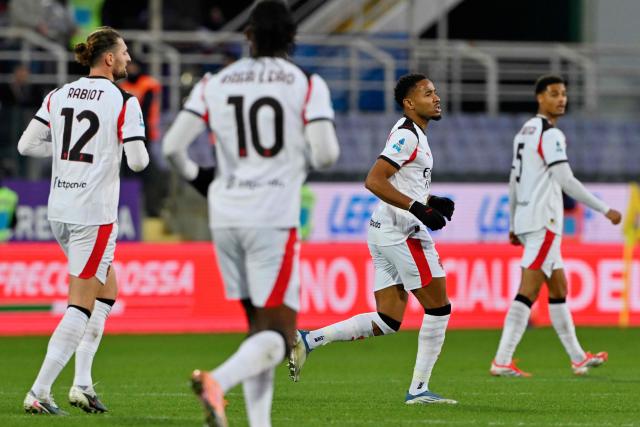 AC Milan's French forward #18 Christopher Nkunku celebrates after scoring a goal during the Italian Serie A football match between ACF Fiorentina and AC Milan at Artemio Franchi stadium in Florence on January 11, 2026. (Photo by Andreas SOLARO / AFP)