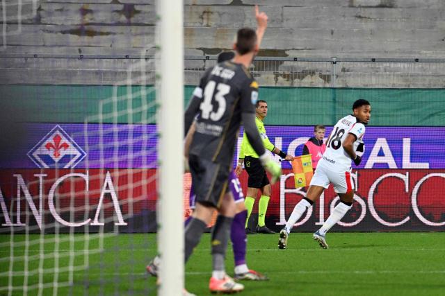 AC Milan's French forward #18 Christopher Nkunku celebrates after scoring a goal during the Italian Serie A football match between ACF Fiorentina and AC Milan at Artemio Franchi stadium in Florence on January 11, 2026. (Photo by Andreas SOLARO / AFP)