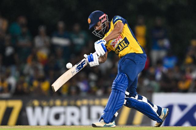 Sri Lanka's Dhananjaya de Silva plays a shot during the third and final Twenty20 international cricket match between Pakistan and Sri Lanka at the Rangiri Dambulla International Stadium in Dambulla on January 11, 2026. (Photo by Ishara S. KODIKARA / AFP)