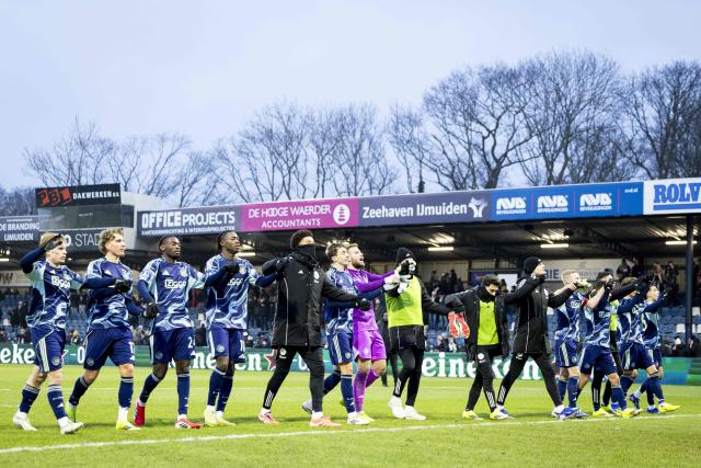 Ajax players celebrate their victory at the end of the Dutch Eredivisie football match between Telstar and Ajax at BUKO Stadion in Velsen-Zuid on January 11, 2026. (Photo by Sonny Lensen / ANP / AFP) / Netherlands OUT