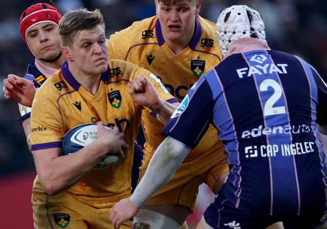 Northampton Saints' English flanker Tom Pearson (2ndL) is challenged by Bordeaux-Begles' French hooker Maxime Lamothe (R) during the European Champions Cup first round, day 3, pool 4, rugby union match between Bordeaux-Begles and Northampton Saints at the Chaban-Delmas stadium in Bordeaux on January 11, 2026. (Photo by ROMAIN PERROCHEAU / AFP)