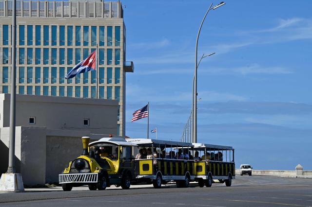 A tourist train rides past the US embassy in Havana on January 11, 2026. Cuba's President Miguel Diaz-Canel rebuffed US President Donald Trump's threat against his country, vowing to defend it following Washington's capture of the leader of his ally Venezuela. (Photo by ADALBERTO ROQUE / AFP)