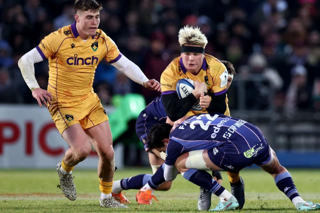 Northampton Saints' English number 8 Henry Pollock is tacked by Bordeaux-Begles' French fly-half Joey Carbery (R) during the European Champions Cup first round, day 3, pool 4, rugby union match between Bordeaux-Begles and Northampton Saints at the Chaban-Delmas stadium in Bordeaux on January 11, 2026. (Photo by ROMAIN PERROCHEAU / AFP)