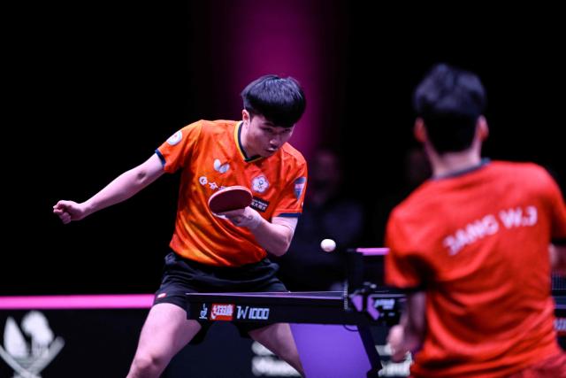 Taiwan's Lin Yun-ju hits a return against South Korea's Jang Woojin during their men's singles final match in the World Table Tennis (WTT) Champions tournament at the Infinity Arena in Doha on January 11, 2026. (Photo by Mahmud HAMS / AFP)
