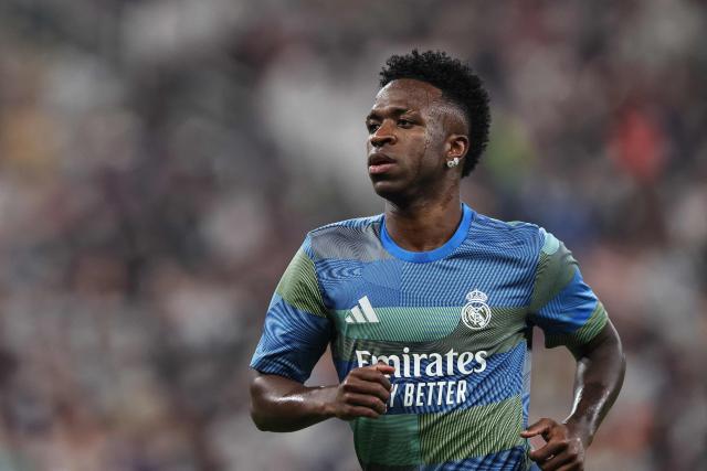 Real Madrid's Brazilian forward #07 Vinicius Junior warms up prior to the start of the Spanish Super Cup final football match between FC Barcelona and Real Madrid at the King Abdullah Stadium in Jeddah on January 11, 2026. (Photo by Fadel SENNA / AFP)
