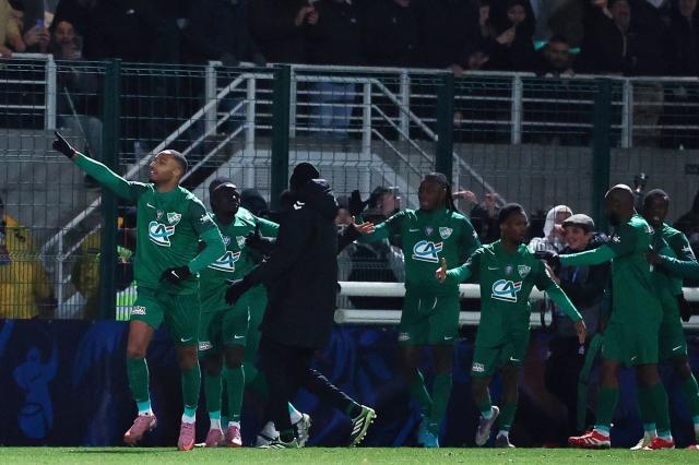 US Chantilly's French forward #07 Evens Joseph (L) celebrates after scoring a goal during the French Cup round of 16 football match between Chantilly and Rennes at the Pierre-Brisson stadium in Beauvais, France on January 11, 2026. (Photo by Anne-Christine POUJOULAT / AFP)