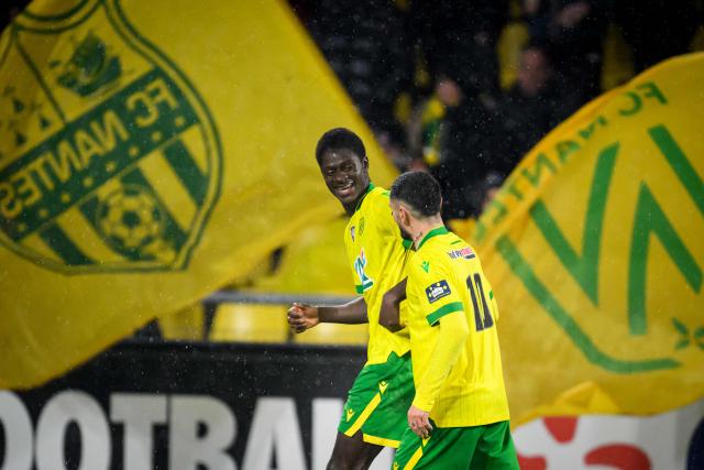 Nantes' French forward #11 Herba Guirassy celebrates after scoring his team's first goal during the French Cup round of 32 football match between FC Nantes and OGC Nice at the Stade de la Beaujoire–Louis Fonteneau in Nantes, western France on January 11, 2026. (Photo by Loic VENANCE / AFP)